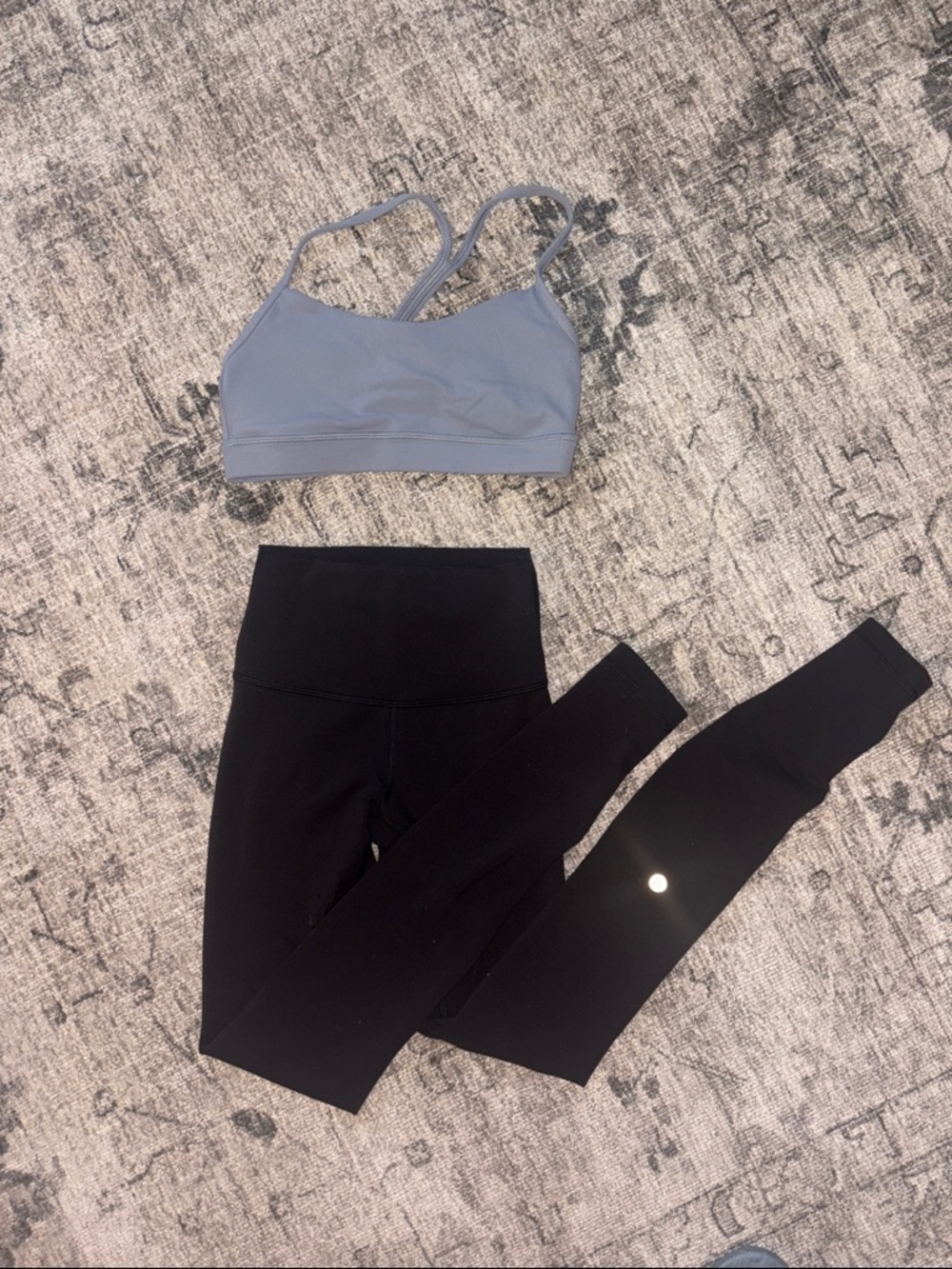 lululemon blue sports bra with black leggings